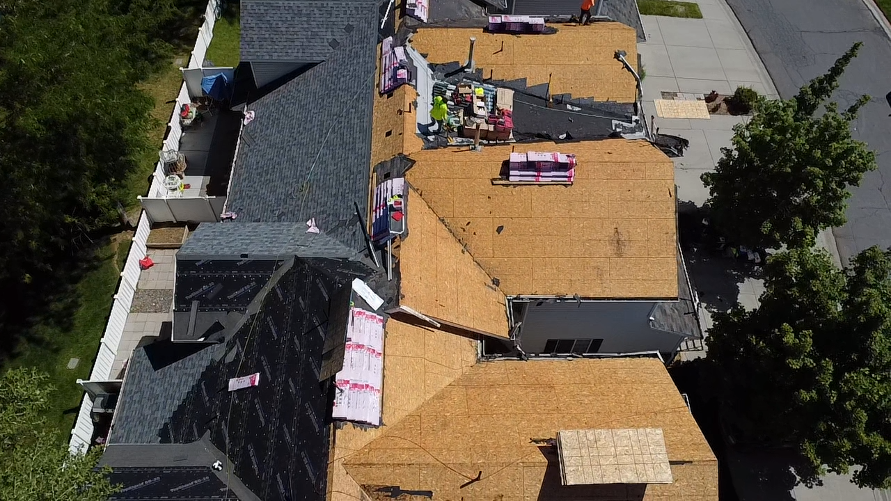 New plywood decking and underlayment mid-installation